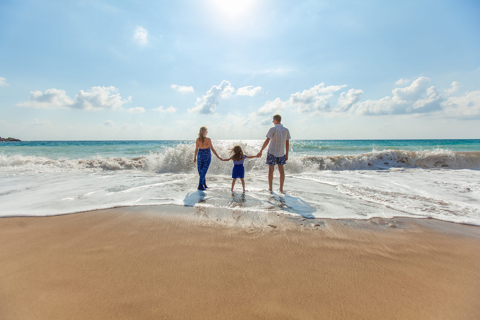 Snohomish family on beach pain free after chiropractic treatment.